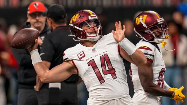 Washington Commanders quarterback Sam Howell (14) warms up on the field prior to the game against the Atlanta Falcons at Mercedes-Benz Stadium. Mandatory Credit: Dale Zanine-USA TODAY Sports